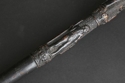 Lot 12 - A carved folk art bog oak walking stick