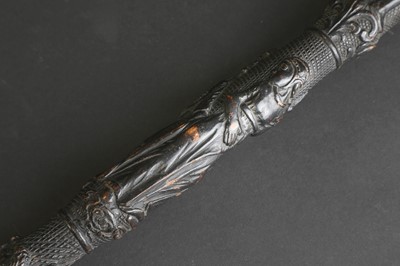 Lot 12 - A carved folk art bog oak walking stick