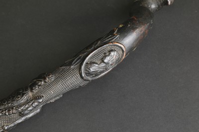 Lot 12 - A carved folk art bog oak walking stick