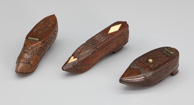 Lot 194 - A set of three folk art snuff shoes