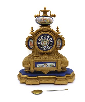 Lot 156 - A French gilt metal and porcelain mounted mantel clock on stand