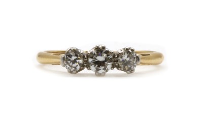 Lot 109 - A gold three stone diamond ring
