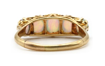 Lot 14 - An 18ct gold five stone opal ring