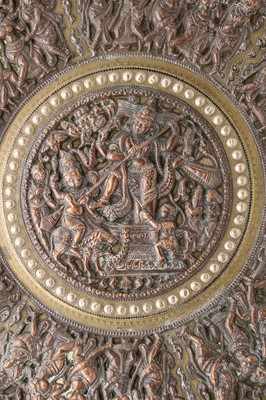 Lot 242 - A large Indian silvered copper and brass Thanjavour charger