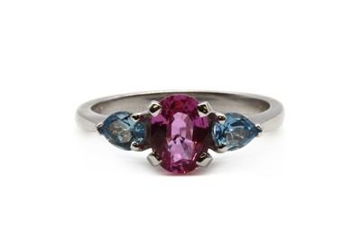 Lot 179 - An 18ct white gold pink sapphire and aquamarine three stone ring
