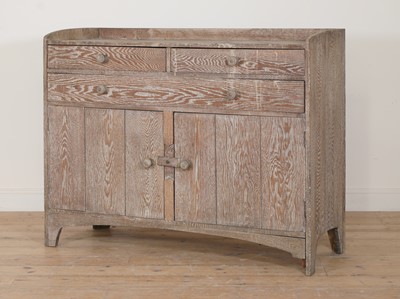 Lot 118 - An Heal & Co. limed oak dresser