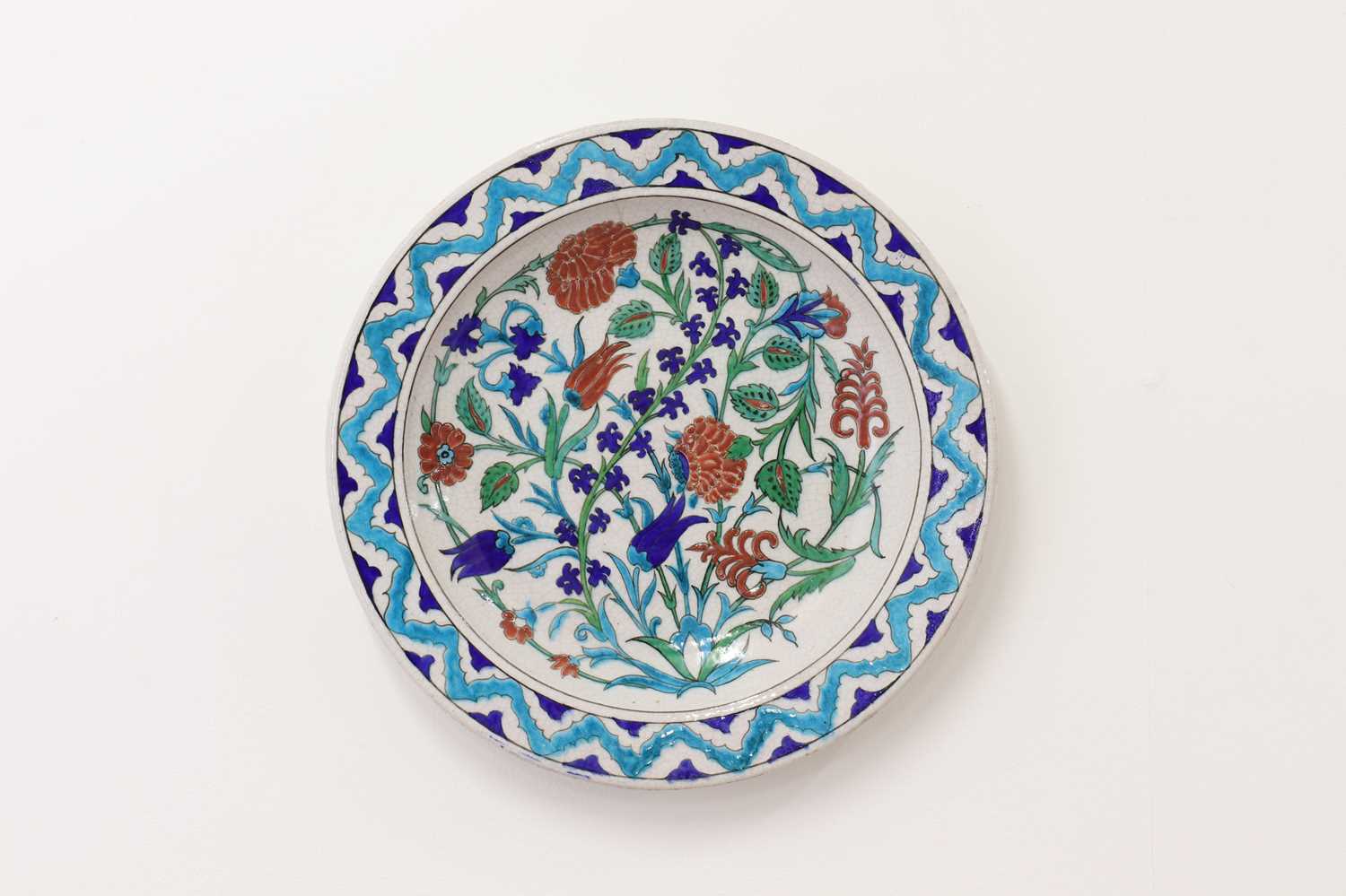 Lot 49 - An Iznik-style pottery charger by Théodore Deck