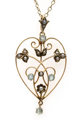 Lot 42 - A gold paste and split pearl pendant