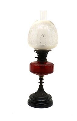 Lot 86 - A Victorian cranberry glass oil lamp