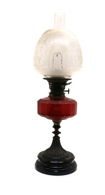 Lot 86 - A Victorian cranberry glass oil lamp