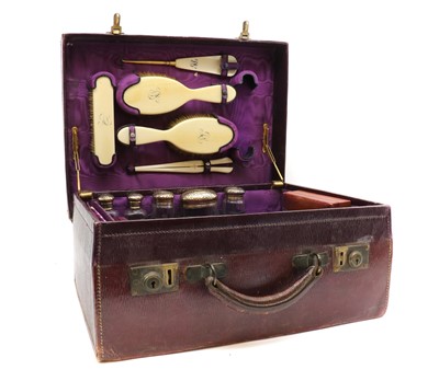 Lot 38 - A travelling case in burgundy Morocco leather