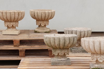 Lot 259 - A set of six composition stone garden urns