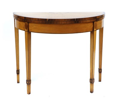 Lot 457 - A George III style satinwood tea table