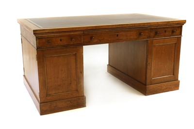 Lot 435 - An oak pedestal partners desk