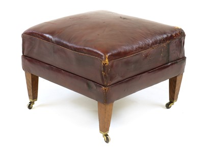 Lot 345 - A red leather upholstered footstool in the manner of Howard and Sons