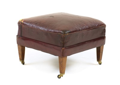 Lot 345 - A red leather upholstered footstool in the manner of Howard and Sons