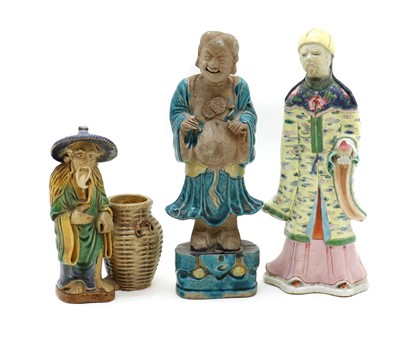 Lot 137 - A group of three Chinese pottery figures