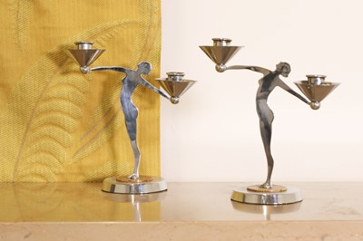 Lot 182 - A pair of chromed Art Deco figural candlesticks