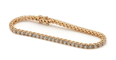Lot 159 - An 18ct rose gold diamond line bracelet