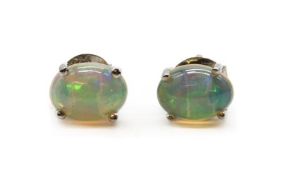 Lot 318 - A pair of silver single stone opal stud earrings