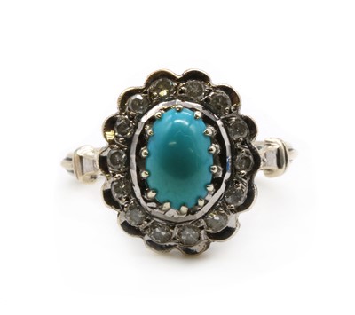 Lot 284 - A white gold turquoise and diamond cluster ring