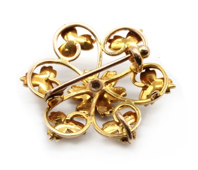 Lot 41 - An Edwardian gold split pearl flower brooch/pendant
