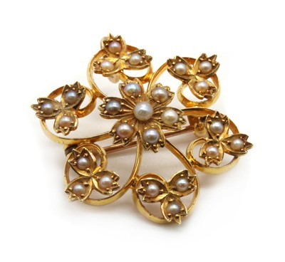 Lot 41 - An Edwardian gold split pearl flower brooch/pendant