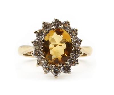 Lot 195 - A 9ct gold citrine and cubic zirconia cluster ring