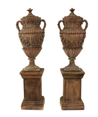 Lot 279 - A pair of faux terracotta garden urns