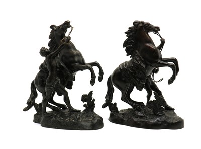 Lot 260 - A pair of bronzed Marly horses