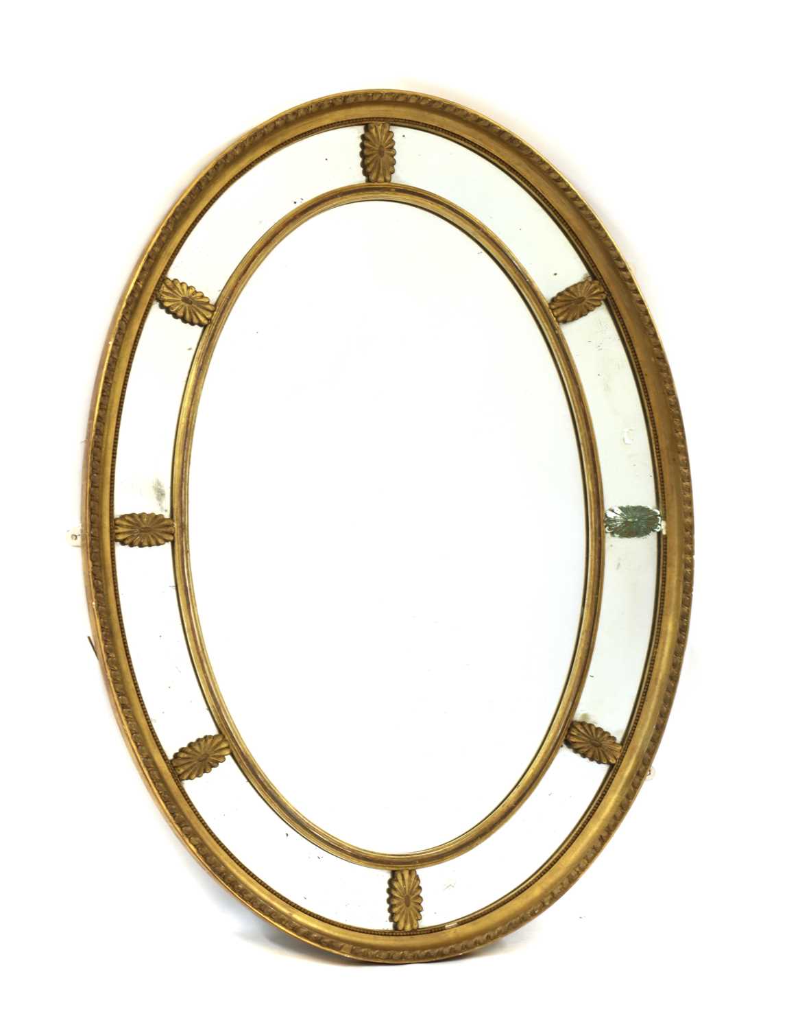 Lot 388 - An oval gilt gesso marginal wall mirror