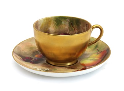 Lot 52 - A Royal Worcester porcelain Fallen Fruits teacup and saucer