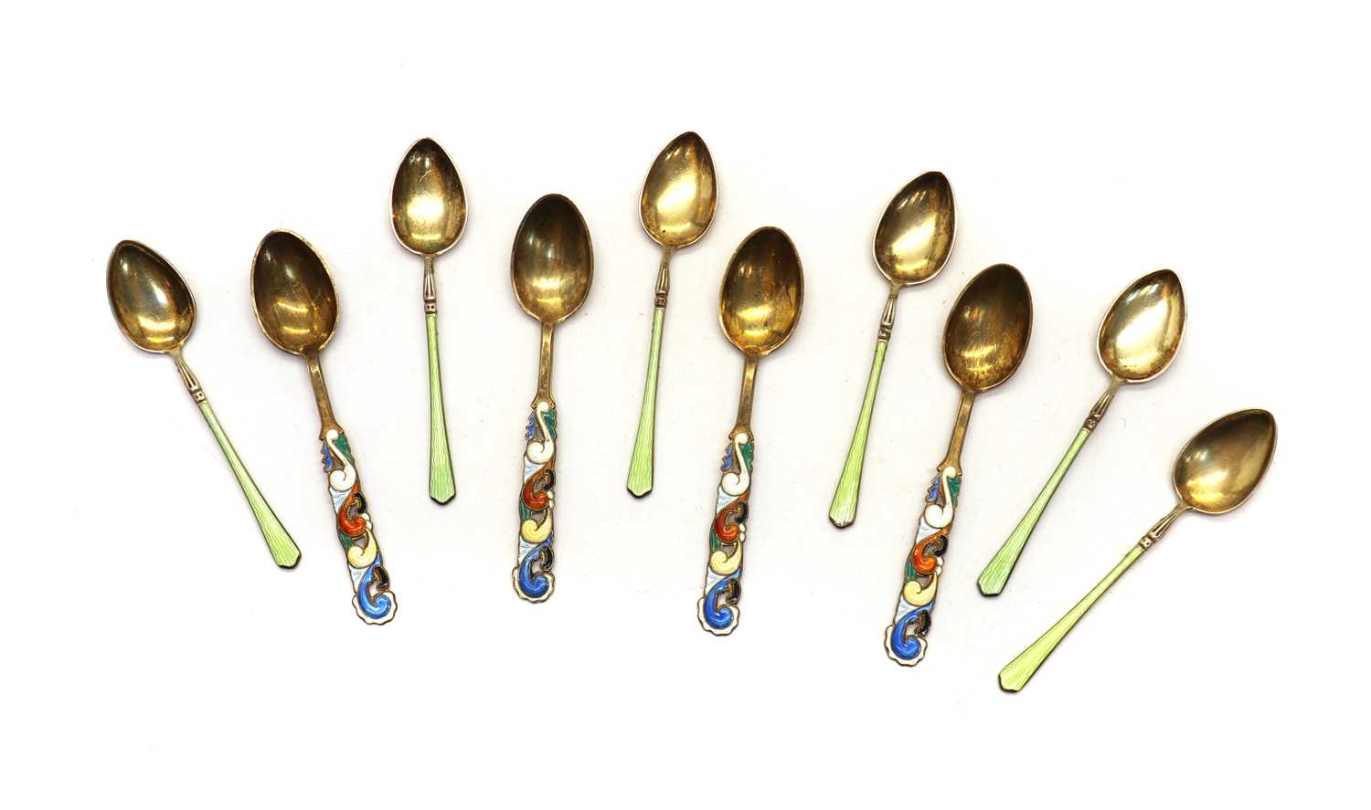 Lot 24 - A group of four Norwegian silver gilt and enamel spoons