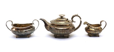 Lot 32 - A composed George IV silver three piece silver tea service