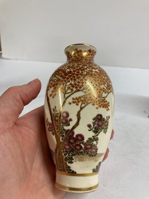 Lot 135 - A pair of Japanese Satsuma ware vases