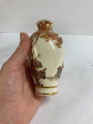 Lot 135 - A pair of Japanese Satsuma ware vases