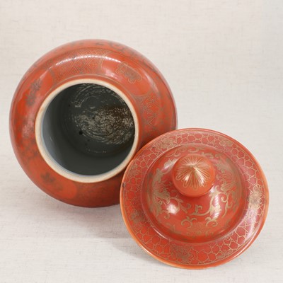 Lot 51 - A pair of Chinese coral-ground vases and covers