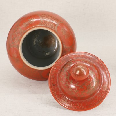 Lot 51 - A pair of Chinese coral-ground vases and covers