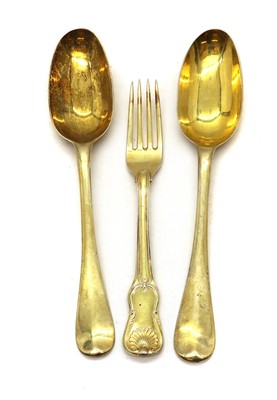 Lot 128 - A pair of silver gilt dessert spoons