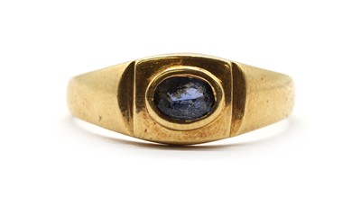 Lot 150 - A gold single stone sapphire ring