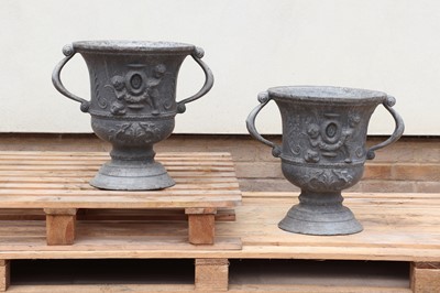 Lot 244 - A pair of twin-handled lead urns