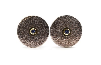 Lot 313 - A pair of sterling silver sapphire set cufflinks