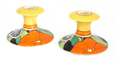 Lot 216 - A pair of Clarice Cliff 'Red Gardenia' candlesticks