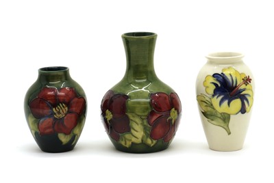Lot 56 - A small Moorcroft pottery 'Hibiscus' pattern vase