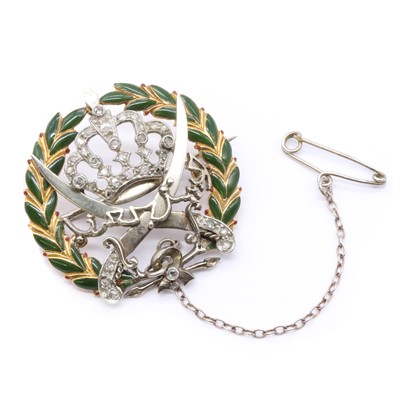 Lot 14 - A gold enamel and diamond set Arab Legion brooch