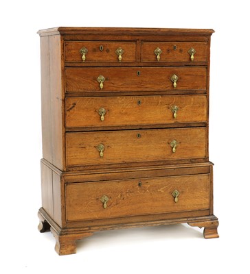 Lot 395 - A oak chest on stand