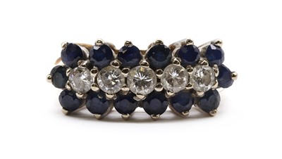 Lot 155 - A gold sapphire and diamond cluster ring