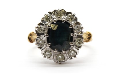 Lot 158 - A gold sapphire and diamond cluster ring