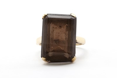 Lot 132 - A 9ct gold single stone smoky quartz ring