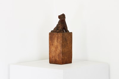 Lot 136 - A carved wooden terrier